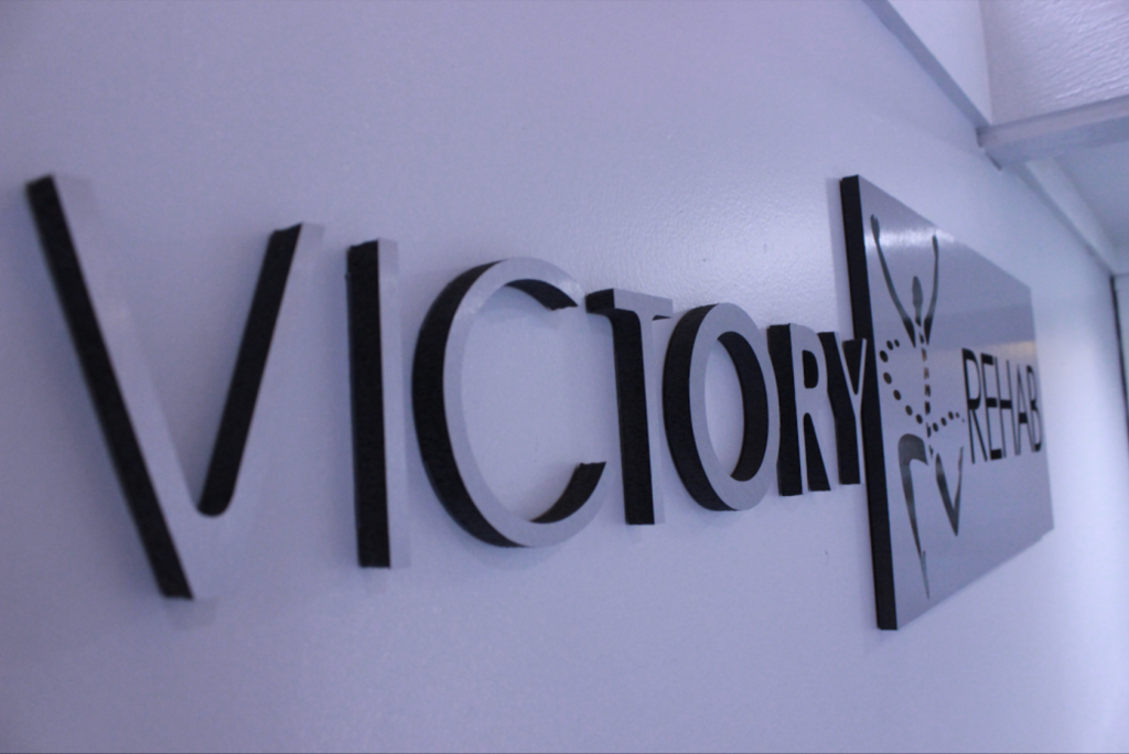 victory rehab chiro clinic store front sign